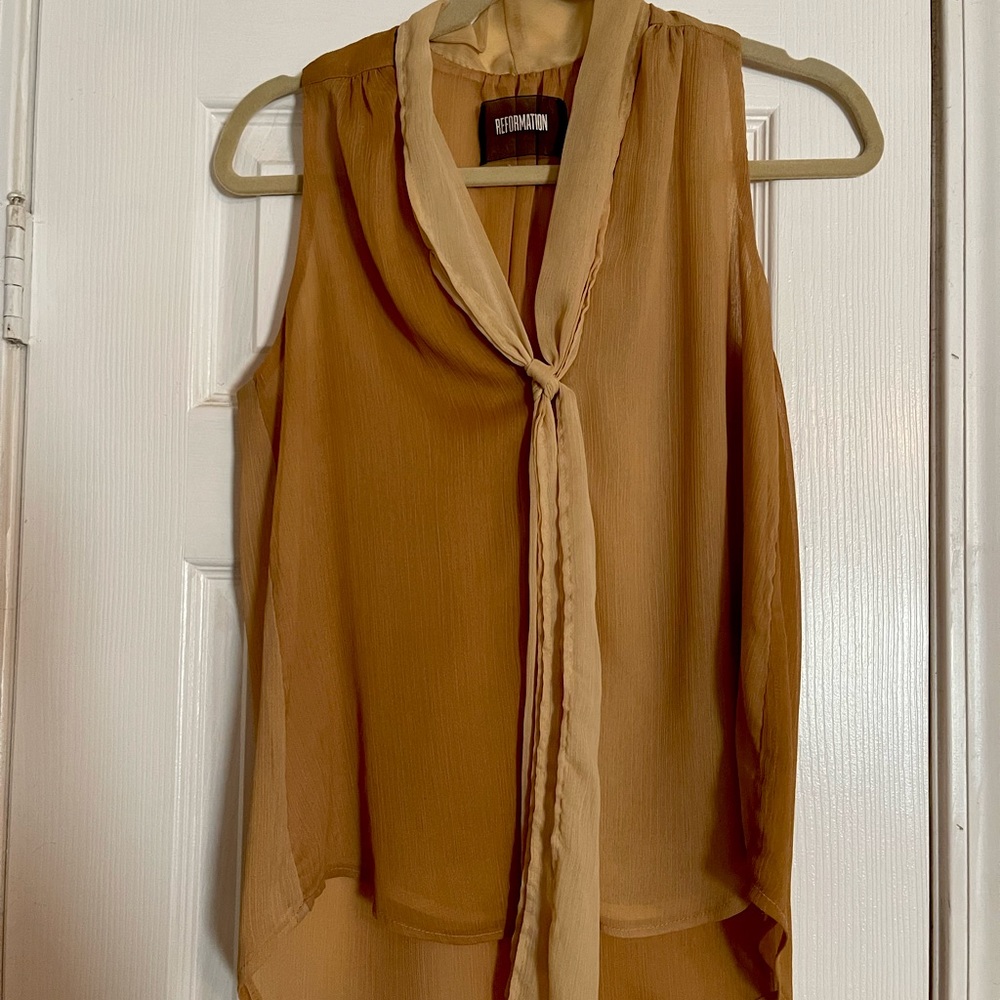 Ladies’ Reformation two-toned sleeveless blouse with contrasting tie. Tan/cream
